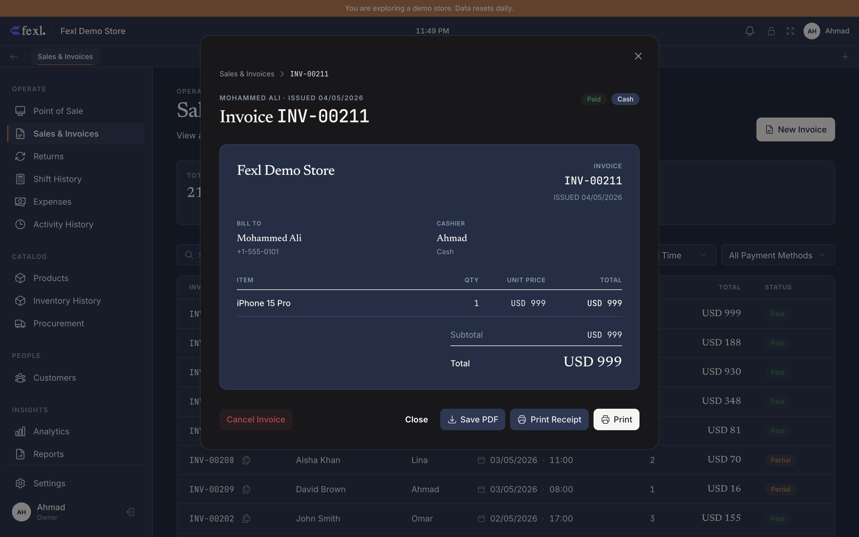 Invoice detail dialog — header chips (customer name, issue date, Paid status, Cash payment method), invoice number, Bill To / Cashier, line items table, Subtotal / Total, and action bar (Cancel Invoice, Close, Save PDF, Print Receipt, Print)