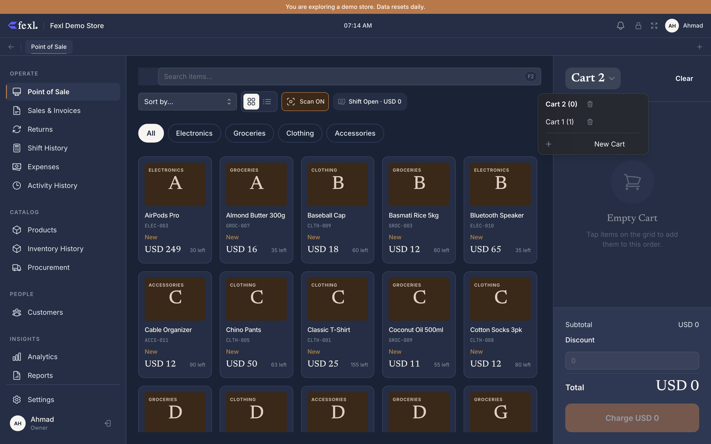 POS cart switcher — atelier replaced the old left-aligned tab strip with a dropdown on the cart header. Active cart name (Cart 2) carries a chevron; opening it lists every cart (Cart 2 (0), Cart 1 (1)) with a Trash icon per row and a + New Cart action below the divider