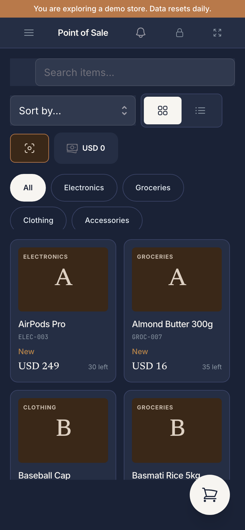 POS at iPhone-13 viewport (390 px) — hamburger menu, Point of Sale title, Search items input, Sort by / grid-vs-list toggle, scan icon and USD 0 cash button, category pills (All / Electronics / Groceries / Clothing / Accessories), 2-column product card grid, floating cart button bottom-right